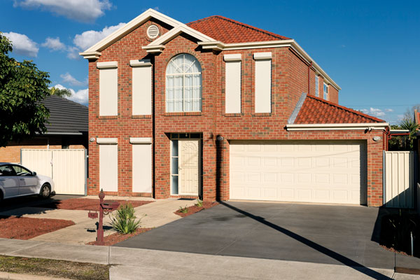 Roller shutters on a two storey home