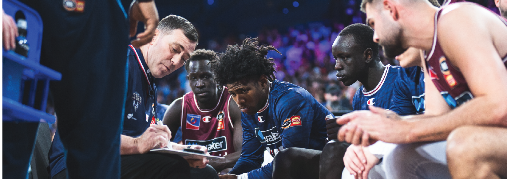 Adelaide 36ers players and coach in discussion